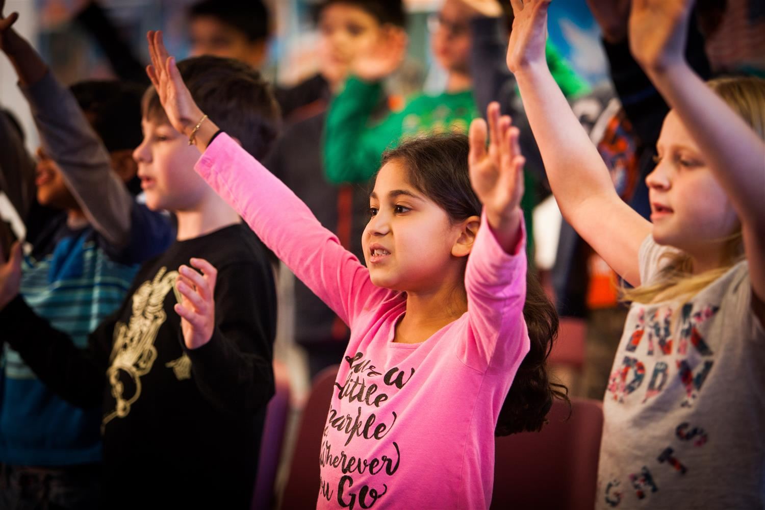 Students with hands in air Students with hands in air